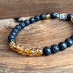 Load image into Gallery viewer, LJ Turtle Aromatherapy bracelets Medium Glow-in-the-Dark Yellow-Orange Glass Beads and Lava Bead Essential Oil Bracelet
