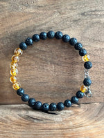 Load image into Gallery viewer, LJ Turtle Aromatherapy bracelets Medium Glow-in-the-Dark Yellow-Orange Glass Beads and Lava Bead Essential Oil Bracelet
