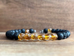 Load image into Gallery viewer, LJ Turtle Aromatherapy bracelets Medium Glow-in-the-Dark Yellow-Orange Glass Beads and Lava Bead Essential Oil Bracelet
